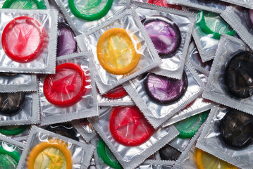 Colorful condoms background.