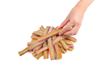 Female hand holding jelly sweets isolated on white background