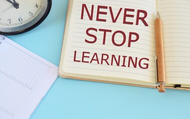 Never stop learning text written in Notebook. Learning concept.