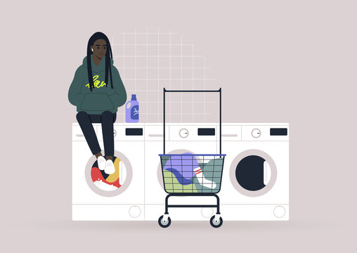 Household chores concept, a young female Black character waiting for their laundry in a coin laundromat