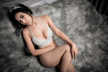 Portrait of asian sexy woman in the bedroom