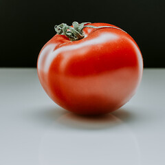 red tomato on a light table