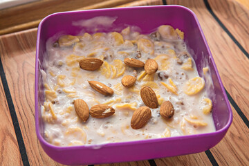almonds and cornflakes with milk for a healthy breakfast