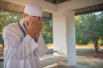 Asian islam man prayer,Young Muslim praying,Ramadan festival concept