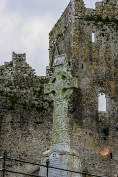 The Rock of Cashel, Tipperary, Ireland. Closeup of large Cashel Ruins Celtic cross. 