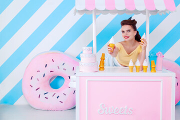 Sexy surprised woman with ice-cream. Colorful background in pop art retro comic style on striped blue background. Pinup and pop art concept