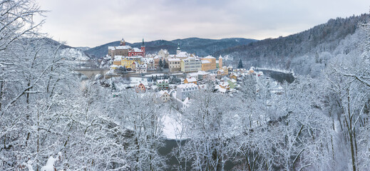 Fototapeta na wymiar Stunning scenic view of beautiful cityscape of medieval Loket nad Ohri town with Loket Castle gothic style on massive rock, colorful buildings during winter season, Karlovy Vary Region, Czech Republic