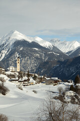 The sunny village of Brienz/Brinzauls in the canton of Graub&uuml;nden in Switzerland. The village is built in a landslide area on unstable ground and the buildings show signs of cracking and deformation. 