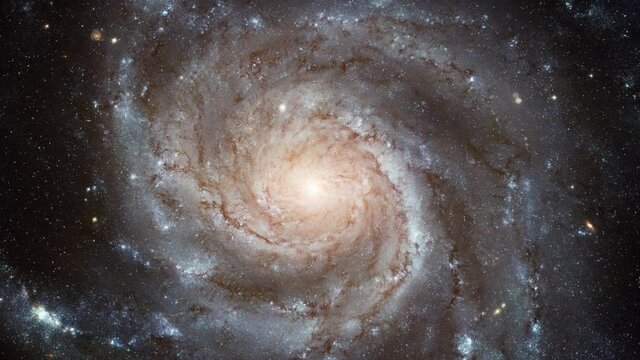 Approaching to Pinwheel galaxy center in outer space, animated rotation. Based on image furnished by Nasa