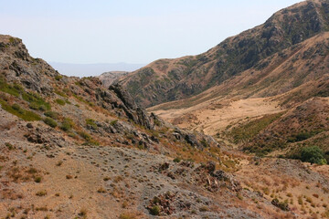 Bektau-Ata Tract. Bektau mountains. Rock formations in Bektau Ata in Kazakhstan in summer. Desert mountains Bektau-Ata. Focus on mountains