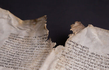 Old Bible scrolls lie on a black background. Religion. Bible. Bible books. Christianity. God....