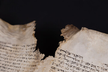 Old Bible scrolls lie on a black background. Religion. Bible. Bible books. Christianity. God....