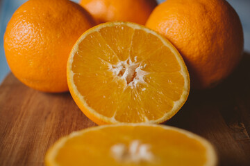 Ripe oranges on wooden background. organic fruit. 