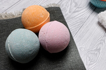 Colorful bath bombs close-up view. Bathing aromatherapy equipment.