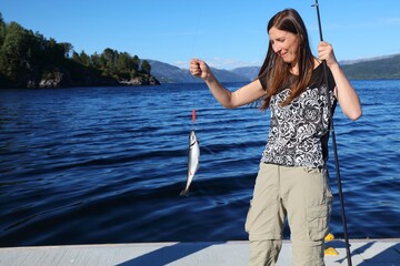Norway fishing - coalfish caught by female angler