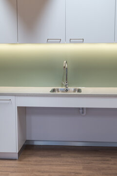 Modern kitchen interior sink with shallow depth for wheelchair access.