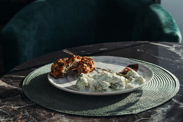 Chicken thighs in pistachios with sauce of broccoli. Healthy diet food.