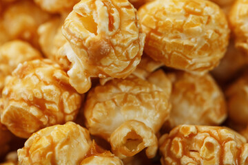 Caramel popcorn macro as a background, full-screen texture.
