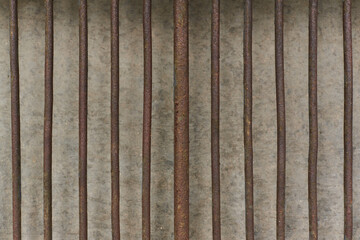 Rusty metal rods protecting concrete wall poverty prison age retro concept in urban scene in Sofia, Bulgaria, Eastern Europe