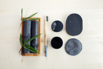 Bamboo charcoal eco friendly cosmetics products. Toothbrush and soap with skin cleansing