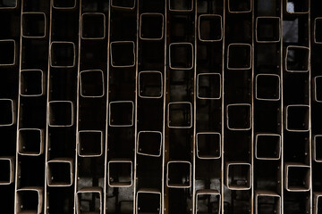 Rusty metal rods isolated on black background poverty prison age retro concept in urban scene