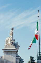 Fototapeta premium Fragment of Vittorio Emanuele II monument and Italian flag. Rome, Italy