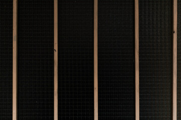 Rusty metal rods isolated on black background poverty prison age retro concept in urban scene