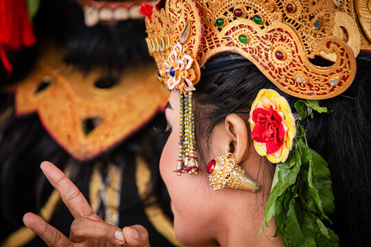 Indonesian Girl With Traditional Costumn. Dancing The Traditional Legong Dance In Pura Saraswati Temple, Ubud, Bali, Indonesia