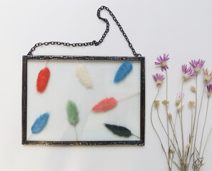 Framed pressed flowers in tiffany technique in stained glass