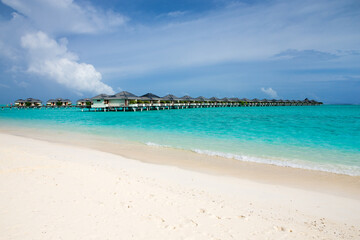 Naklejka premium tropical Maldives island with white sandy beach and sea