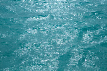 Blue  water with sun reflections