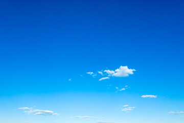 Blue sky background with tiny clouds. fluffy clouds in the sky. Background summer sky