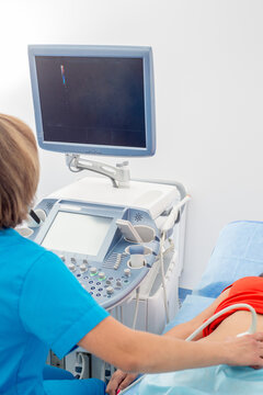 Medical ultrasound scanner close-up. Doctor makes ultrasound diagnosis of belly. Testing pregnant
