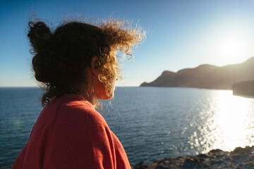 Fototapeta premium Curly girl on the beach
