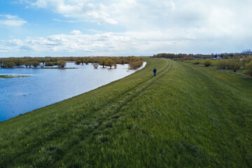 Man walking on dike