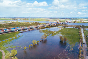 Fototapeta na wymiar Motorway crossing the flooded river meadows