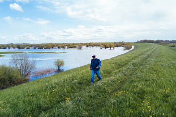 Man walking on dike