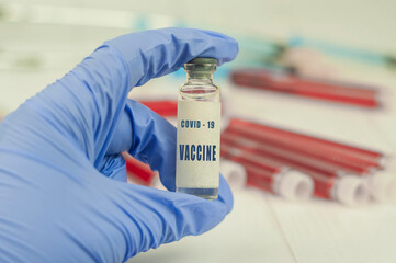 medicine vaccine in a bottle in the doctor's hand for coronavirus pneumonia disease