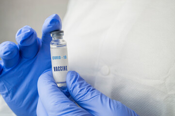medicine vaccine in a bottle in the doctor's hand for coronavirus pneumonia disease