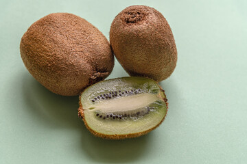 fresh juicy kiwi on a light green surface