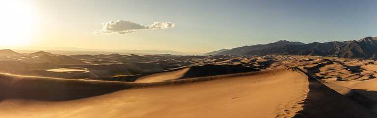 Panorama view of mountains and sandy dunes at sunny day in great sand dunes national park in america