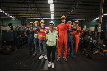 Workers showing thumbs up. group worker in factory on the machine
