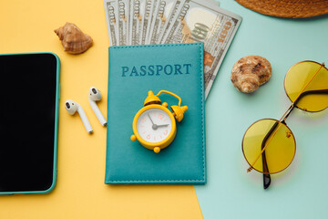 Summer traveling concept. Vacation accessories on colorful background close-up.