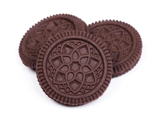 Heap of double chocolate cookies with filling isolated