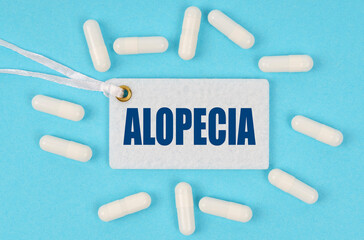 There is a label on the table among the pills that says - ALOPECIA