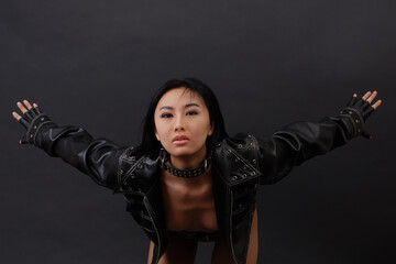 Sexy asian woman in black jacket