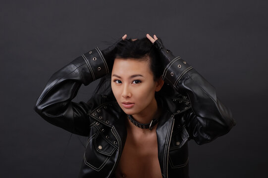 Sexy asian woman in black jacket