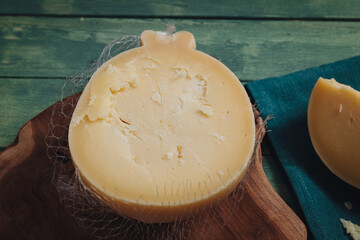 Delicious Caciocavallo cheese on a wooden board