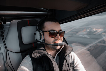 Shallow focus of an adult male doing a plane flight test at daytime