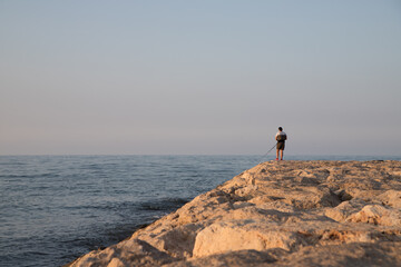 Angler by the sea in Spain